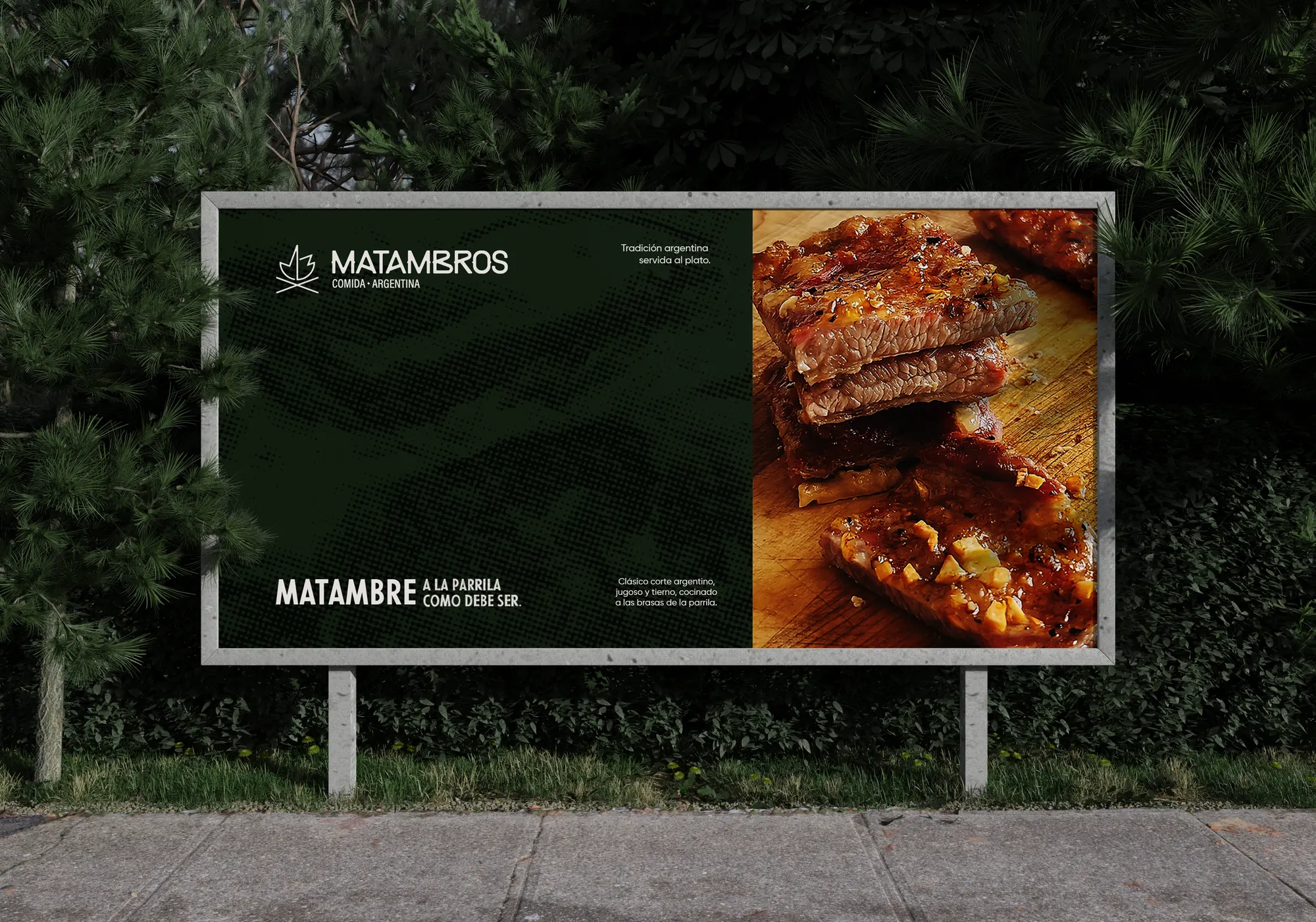Valla publicitaria nocturna de Matambros con el wordmark y una fotografía de asado argentino